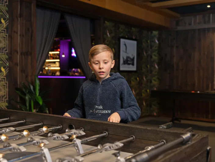 Boy playing games at Skogstad Hotel